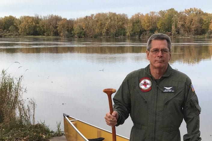 Jim Crigler by RIver with canoe